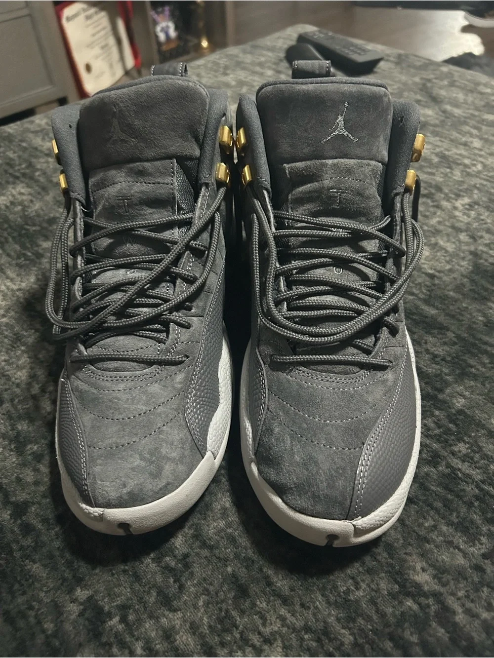 Jordan 12s Retro High Top Sneakers in Gray with Gold Accents